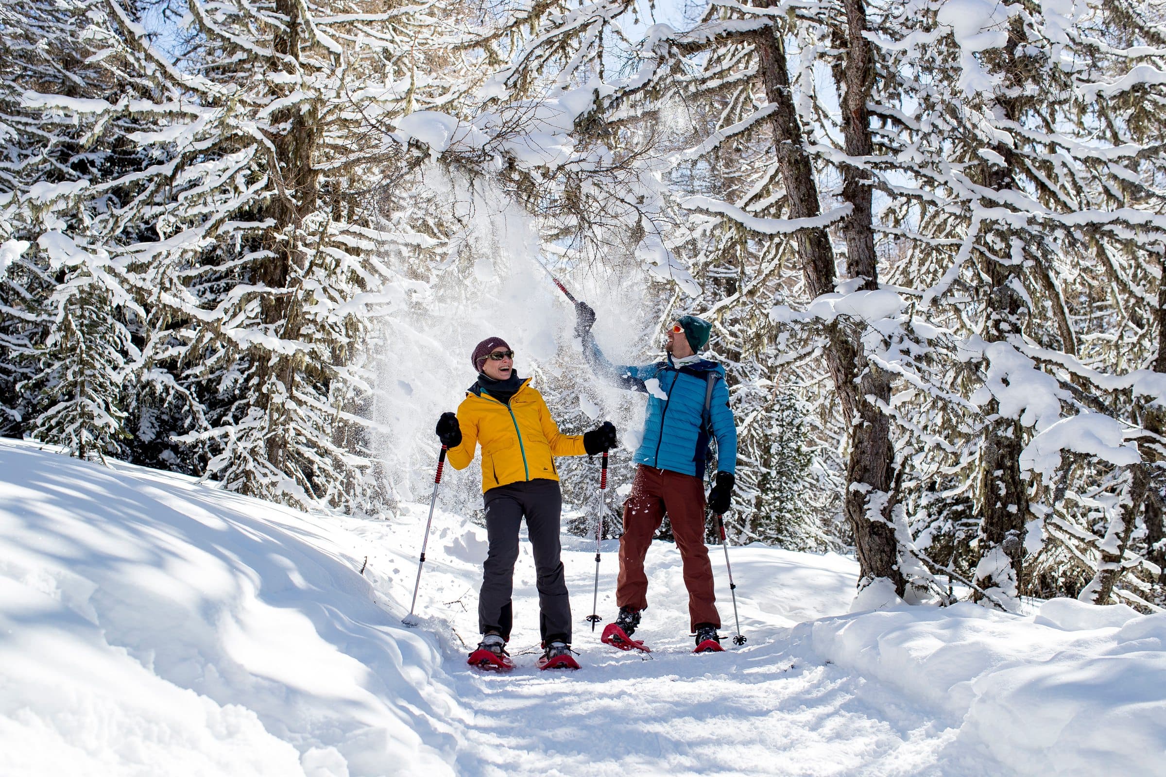 Snowshoeing, two people in the winter forest, Zirbitzkogel